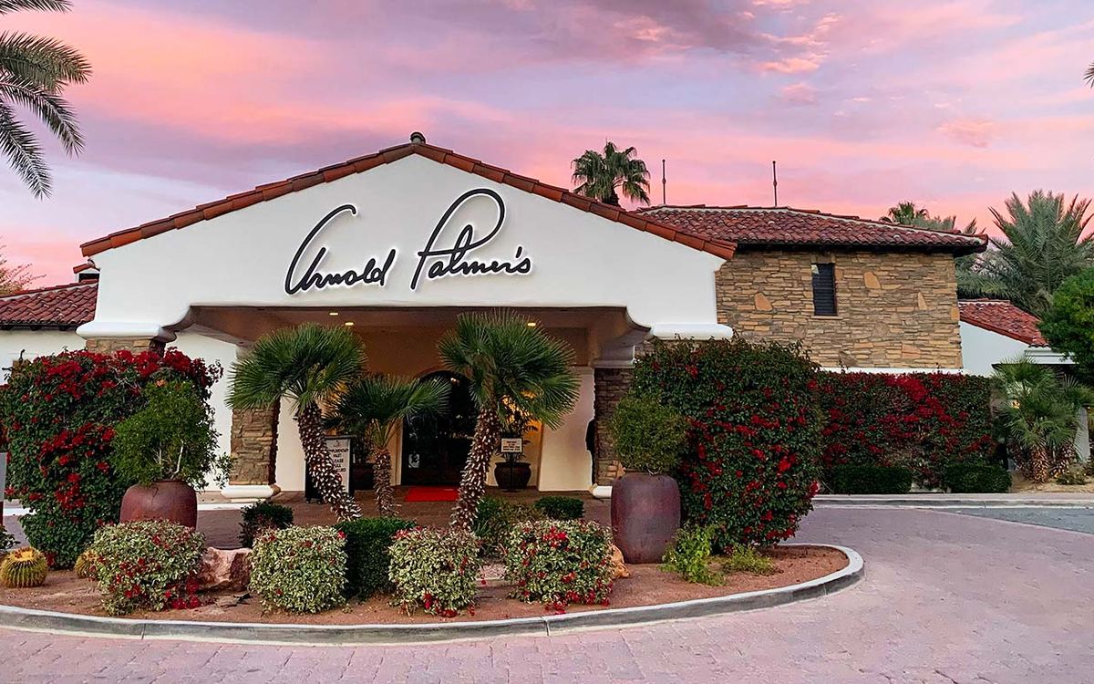 Arnold Palmer's Restaurant entrance in La Quinta at dusk