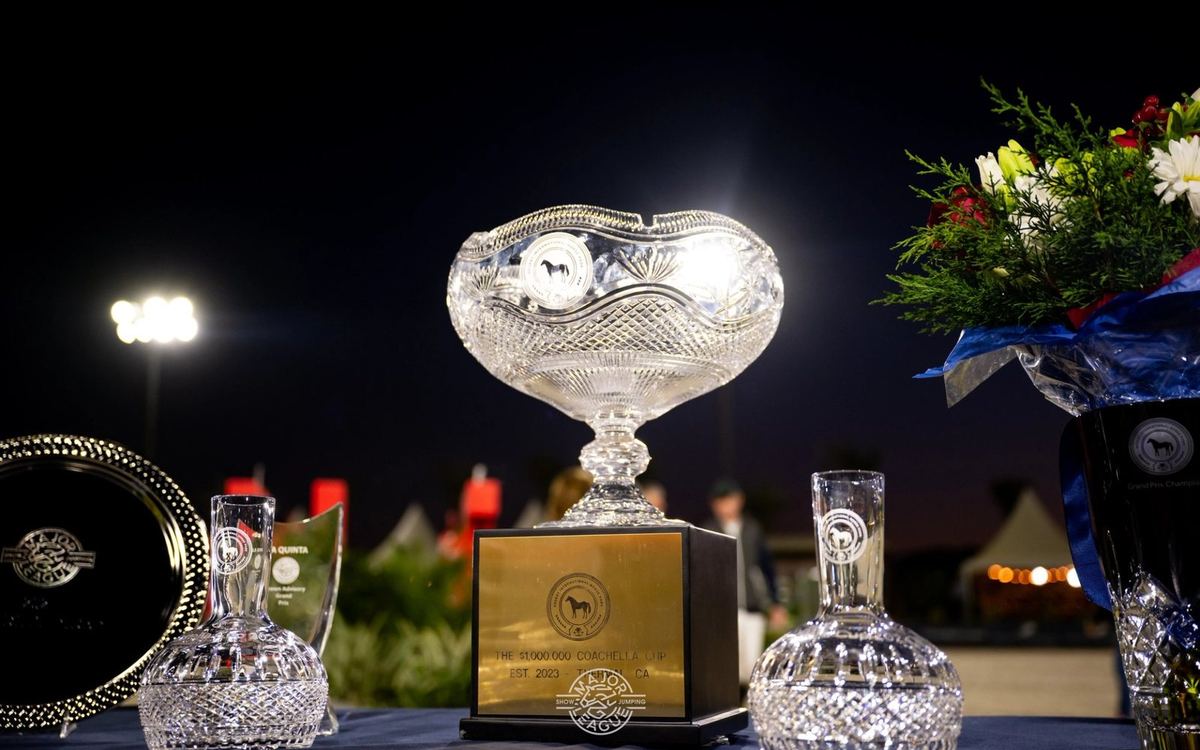 The Coachella Cup trophy on display at night in Palm Springs