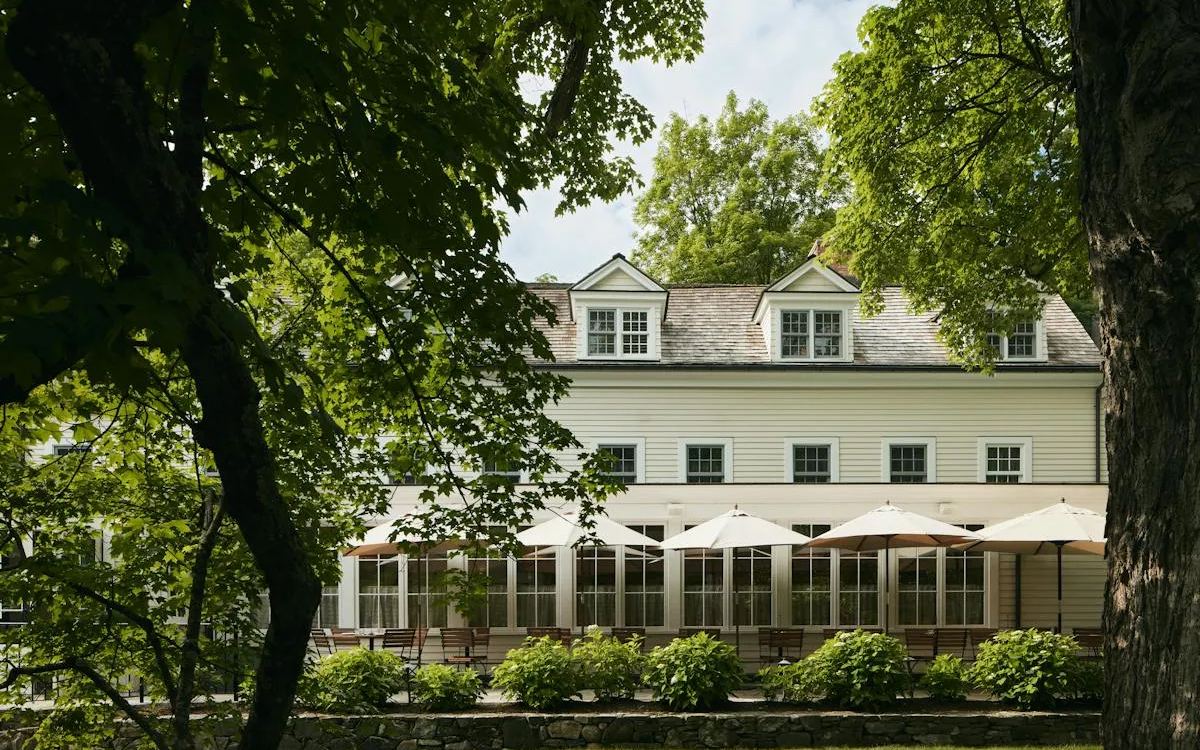 Bedford Post Inn, a white farmhouse among trees