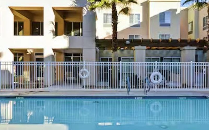 Pool and palm trees at Homewood Suites Palm Desert