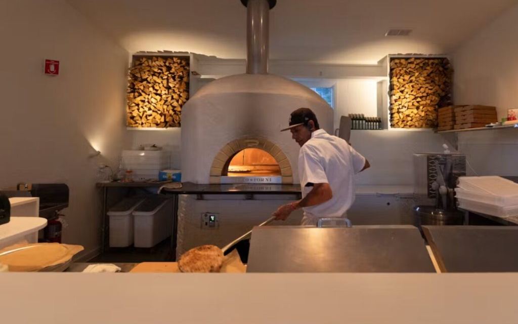 A chef at the wood-fired oven at Fern