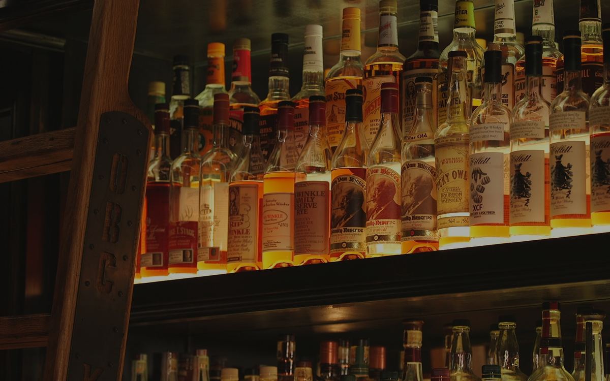 Shelves of bourbon at the OBC Kitchen bar