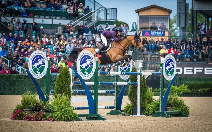 A rider jumps in Rolex Stadium at the Kentucky Horse Park