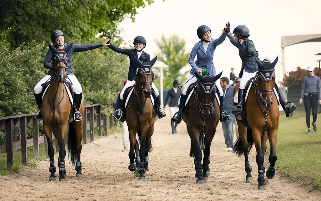 Riders high-five on horseback at Traverse City Horse Shows