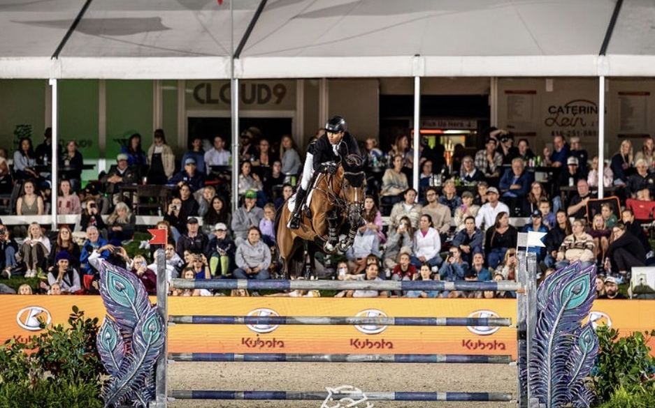 A night jump over the Kubota fence in front of a packed tent at MLSJ Toronto