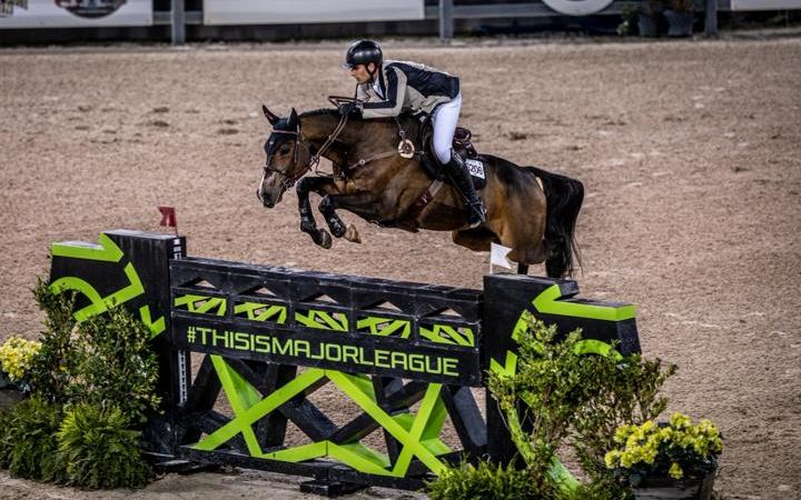 A rider clears a fence at Tryon International